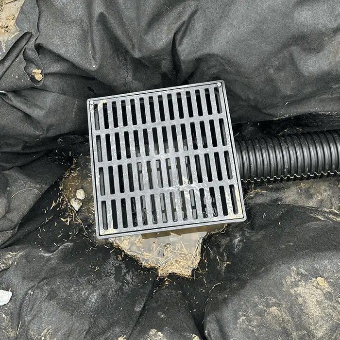 Yard drain being installed