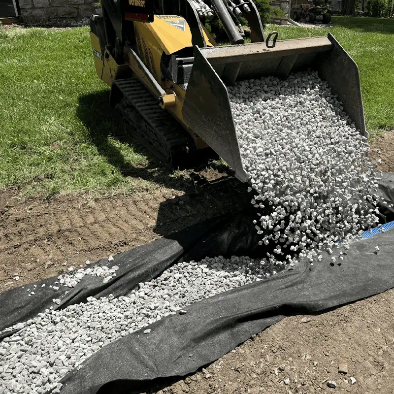 pouring french drain gravel