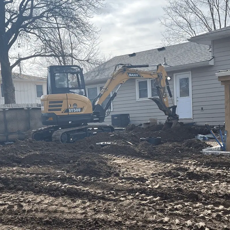 Excavator near house